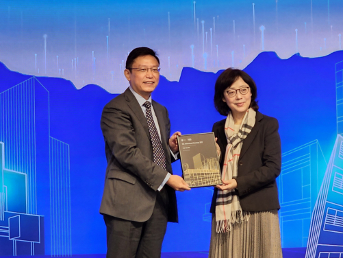 Professor Wei Pan receives the Outstanding People (MiC Advocator) Award from Ms Bernadette Linn, Secretary for Development, HKSAR